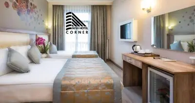 a hotel room with a large bed and a television at Fatih Hotel Corner in Istanbul