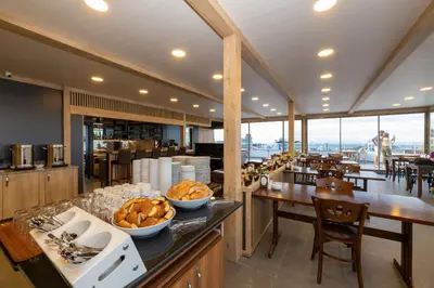 a restaurant with a counter with bowls of food on it at Metro Hotel in Istanbul