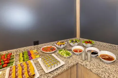 a counter with many different types of food on it at Metro Hotel in Istanbul