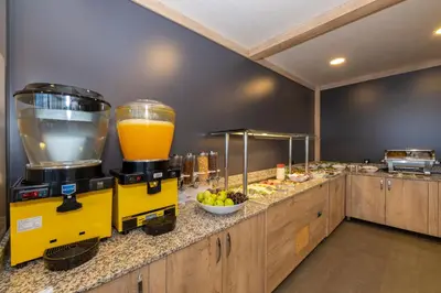 a yellow mixer sitting on top of a counter with food at Metro Hotel in Istanbul