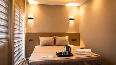 a hotel room with a bed with a blender on it at CK PALACE Hotel in Istanbul