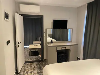 a hotel room with a bed and a mirror at CK PALACE Hotel in Istanbul