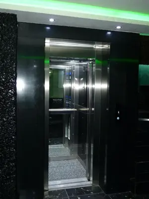 an elevator in a building with a glass door at Ag Şişli Hotel in Istanbul
