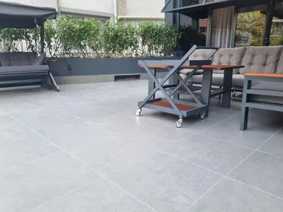 a tile patio with a table and chairs at Mia Berre Hotels in Istanbul