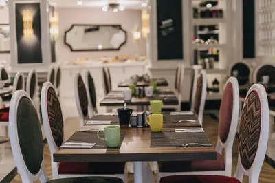 a dining room with long tables and chairs at Mia Berre Hotels in Istanbul