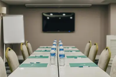 a conference room with a long table with bottles of water at Mia Berre Hotels in Istanbul