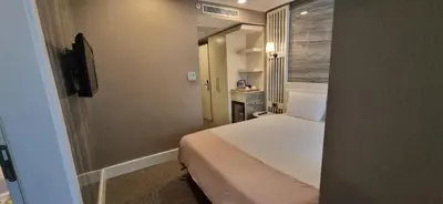 a hotel room with a bed and a bathroom at Mia Berre Hotels in Istanbul