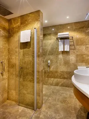 a bathroom with a shower and a sink at Hilton Garden Inn Kocaeli Sekerpinar in Şekerpınarı