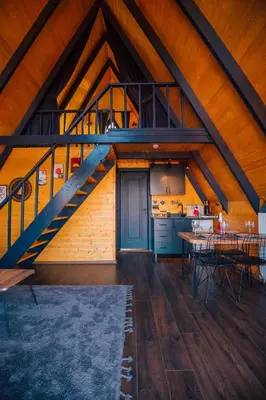 a kitchen and dining room with a wooden ceiling at Ginza Bungalov Sapanca in Sapanca