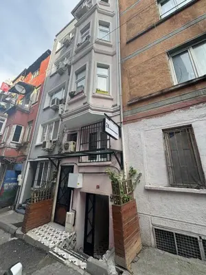 a white building with a sign on the front of it at 24 BOUTİQUE HOTEL in Istanbul