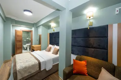 a bedroom with a large bed and a couch at İSTA PALACE-GRAND BAZAAR in Istanbul