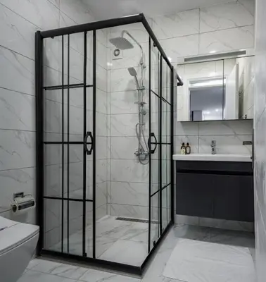 a shower with a glass door in a bathroom at Private Modern 2BR1Bath Bebek Gem! #80 in Istanbul