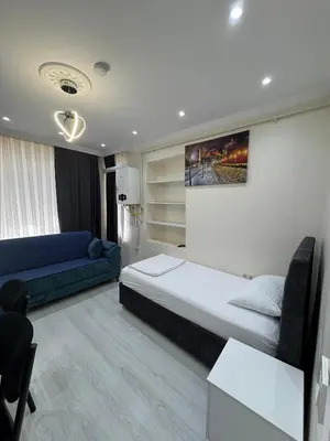 a hotel room with a bed and a couch at CEM Apart in Istanbul