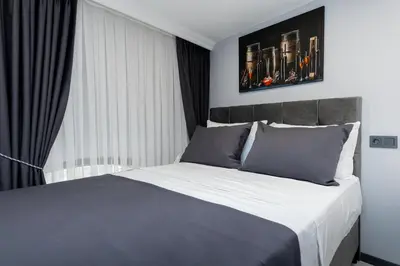 a bedroom with a large bed and a window at Aya Langa Guest House in Istanbul