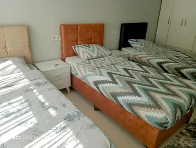 two beds in a small room with two bedsskirts at Orbital Travel House 1 in Istanbul
