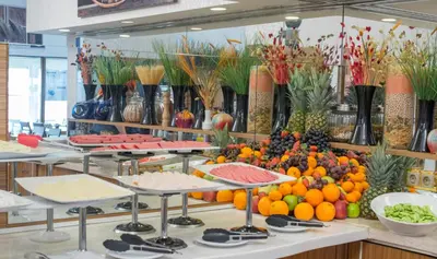 a buffet with many different fruits and vegetables on display at MidMar Deluxe Hotel in Istanbul