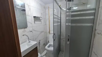 a bathroom with a shower and a toilet and a sink at Cozy Spacious near Green Mosque in Yıldırım
