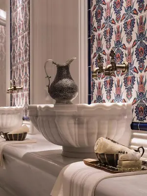 a vase sitting on a table in a room at Atar Airport Hotel - Restaurant & Spa Wellness in Arnavutköy
