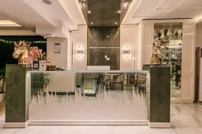 a lobby with a counter with two statues of horses at Atar Airport Hotel - Restaurant & Spa Wellness in Arnavutköy