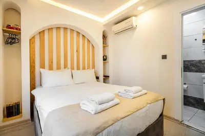 a bedroom with a bed with towels on it at Emir Hotel in Istanbul