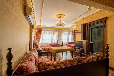 a living room with a couch and a table at The First Ottoman Apartments in Istanbul