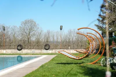 a park with a slide next to a pool at Villa Moon in Gebze