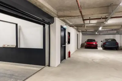a parking garage with two cars parked in it at Carina Gold Hotel And Restaurant in Istanbul