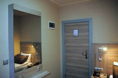 a bathroom with a door leading to a bedroom at Sinem Hotel & Old City in Istanbul