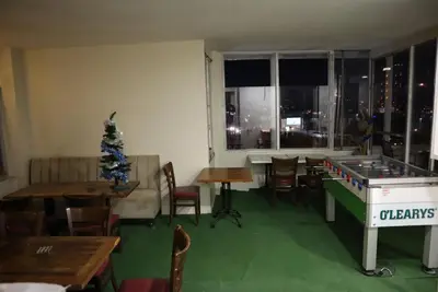 a restaurant with a christmas tree and a ping pong table at Galata istanbul Hotel in Istanbul