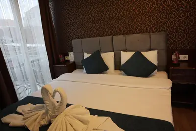 a hotel room with a bed with a towel on it at Galata istanbul Hotel in Istanbul