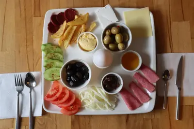 a plate of food with different types of food at Galata istanbul Hotel in Istanbul