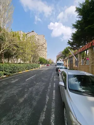 a white car parked on the side of a street at Gardan Hotel in Beylikduzu