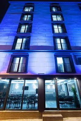 a building with windows and tables in front of it at Ria Suites Boutique Hotel in Istanbul
