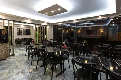 a restaurant with tables and chairs in a room at Ria Suites Boutique Hotel in Istanbul