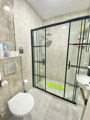 a bathroom with a shower and a toilet and a sink at K&Y Apartments in Taksim 2 in Istanbul