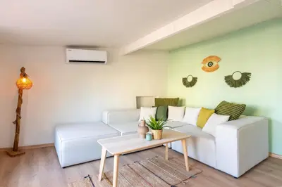 a living room with a white couch and a table at Atlas Han Hotel in Istanbul