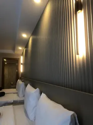 a bedroom with two beds with white pillows at Grand İska Palace in Istanbul