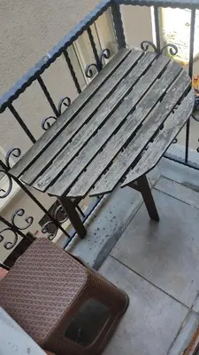 a wooden bench sitting on a sidewalk next to a street at Ore Pera Suites in Istanbul