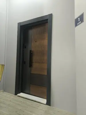 a door in a building with a sign next to it at Ore Pera Suites in Istanbul