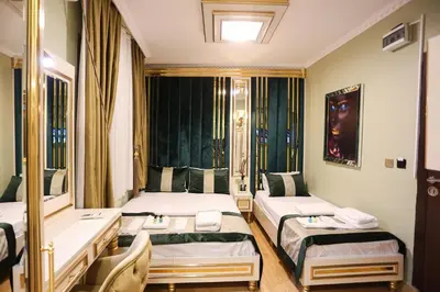 a hotel room with two beds and a window at Whıte Moon Hotel Suites in Istanbul