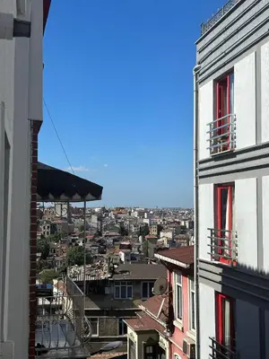 a view of a city from a building with red windows at Whıte Moon Hotel Suites in Istanbul