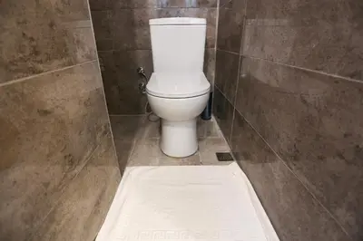 a bathroom with a white toilet in a stall at Whıte Moon Hotel Suites in Istanbul