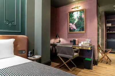 a bedroom with a desk and a bed at Orient Occident Hotel Istanbul, Autograph Collection in Istanbul