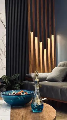 a table with a blue bowl and a bottle on it at Meridiani Taksim Hotel in Istanbul