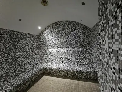 a room with a bath tub in a brick wall at Taksim Square Residence, Two bedrooms, pool sauna gym in Istanbul