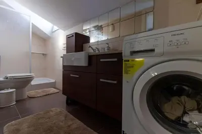 a bathroom with a washing machine in a bathroom at Exclusive Vibrant 3BR Duplex w Terrace in Kadıköy! in Istanbul