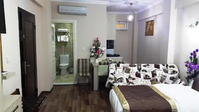 a bedroom with a bed and a bathroom at BeyazitHan Suites Old City in Istanbul