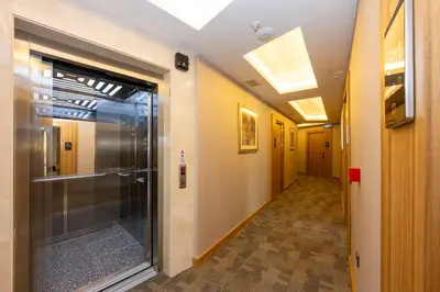a hallway with a glass door in a building at Hotel Ravi in Istanbul