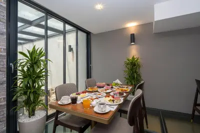 a dining room with a table with food on it at Hotel Ravi in Istanbul