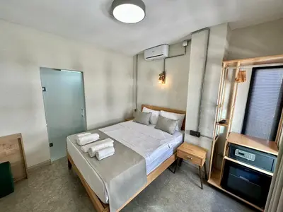 a bedroom with a bed with towels on it at Elegance House Hotel in Istanbul